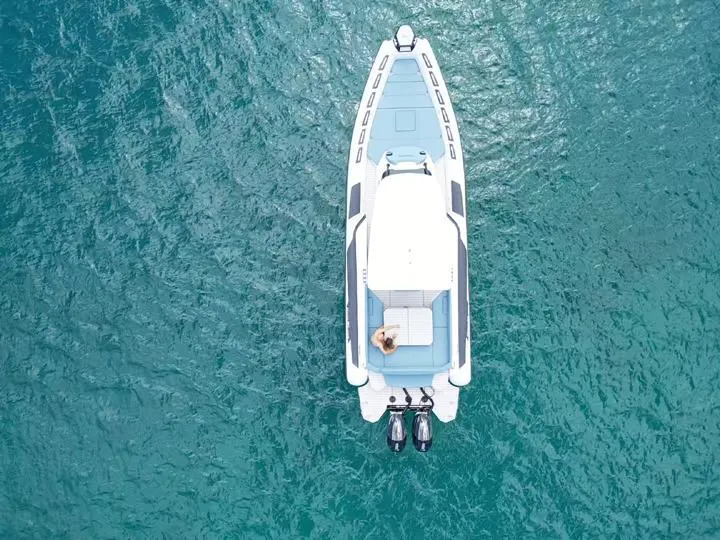 Slide: The Image of Aerial view of 2025 Ranieri CAYMAN 38.0 EXECUTIVE boat on clear blue water. - 2