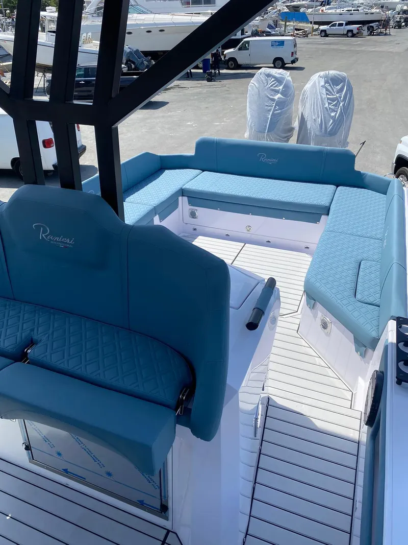 Slide: The Image of 2025 Ranieri CAYMAN 38.0 EXECUTIVE boat with blue seating and white deck. - 21