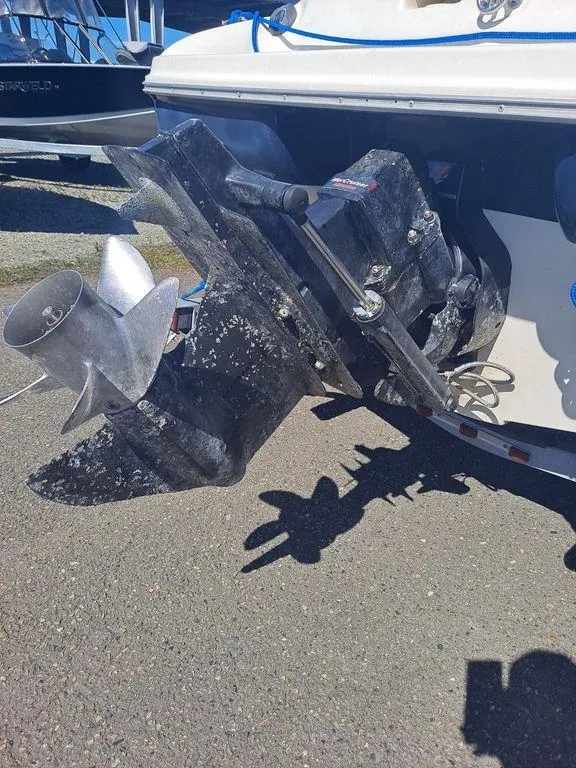 Slide: The Image of Close-up of a 2001 Bayliner 185 Capri Sport BR boat propeller and outdrive. - 2