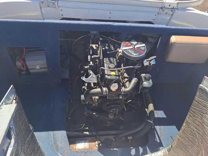 Slide: The Image of 2001 Bayliner 185 Capri Sport BR engine compartment with visible motor and components. - 7