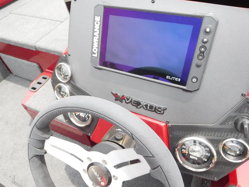 Slide: The Image of 2024 Vexus AVX 1880 V2 boat dashboard with Lowrance Elite 8 display. - 2