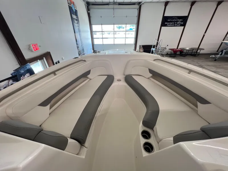 Slide: The Image of 2025 Albemarle 27 Dual Console boat interior with cushioned seating. - 13