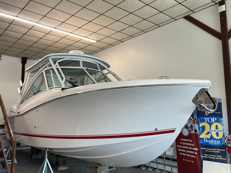 Slide: The Image of 2025 Albemarle 27 Dual Console boat displayed indoors. - 2