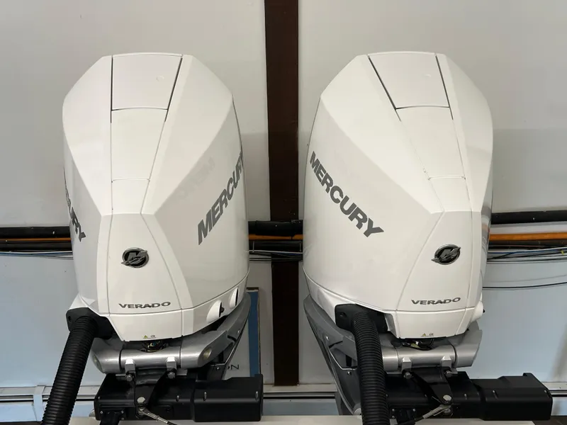 Slide: The Image of Twin Mercury Verado outboard engines on a 2025 Albemarle 27 Dual Console boat. - 3