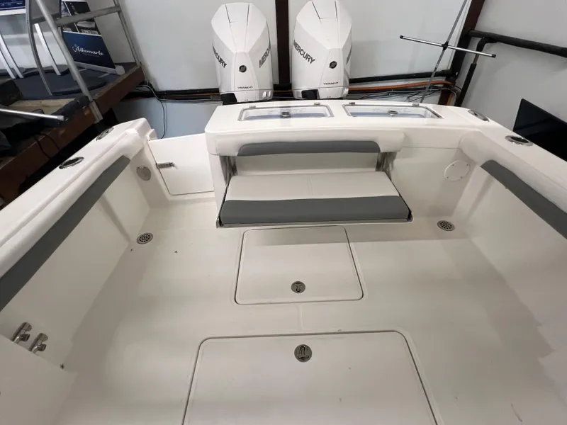 Slide: The Image of 2025 Albemarle 27 Dual Console boat interior with twin Mercury engines. - 5