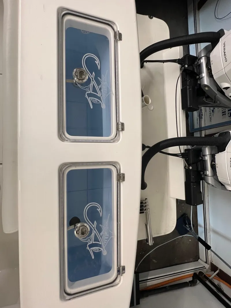 Slide: The Image of 2025 Albemarle 27 Dual Console boat with dual livewells and outboard motors. - 7