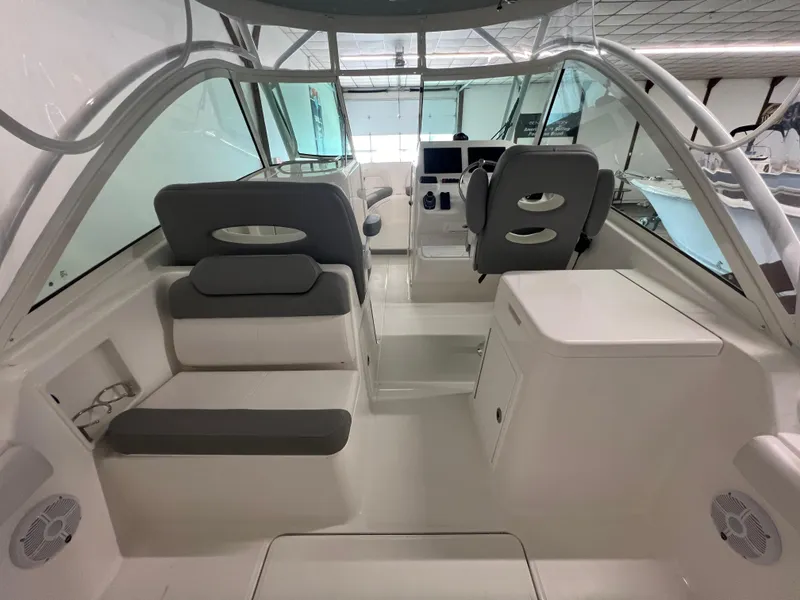 Slide: The Image of 2025 Albemarle 27 Dual Console boat interior with seating and helm station. - 8