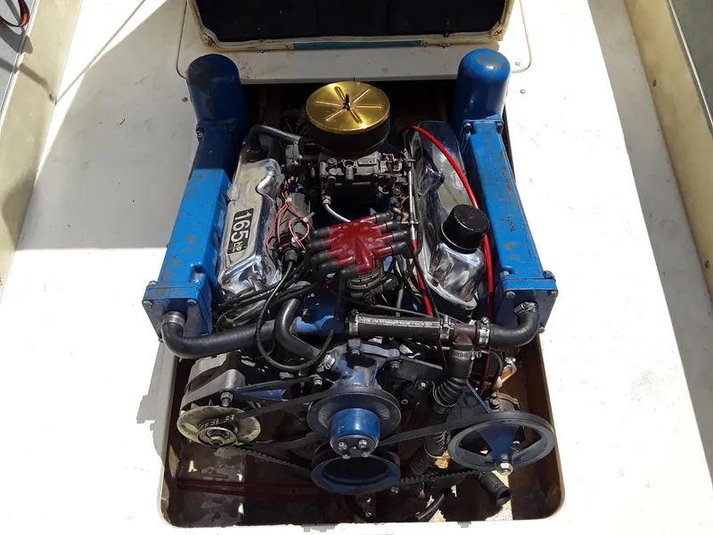 Slide: The Image of 1968 Correct Craft Southwind boat engine in open compartment. - 2