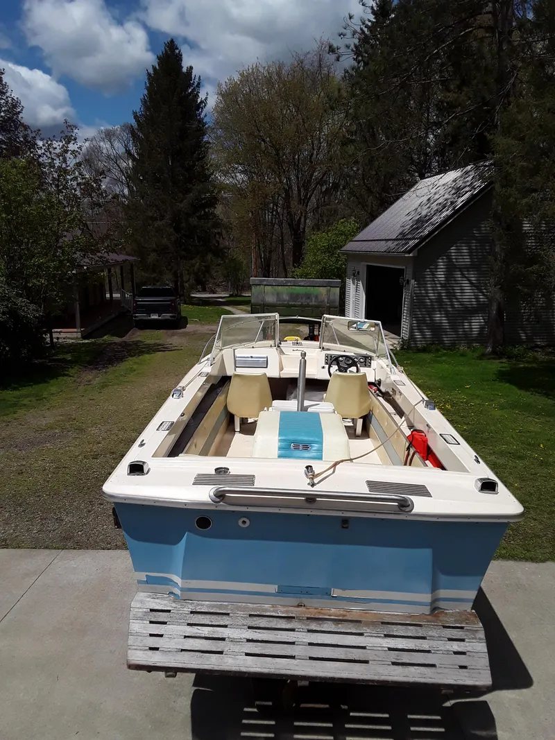 Slide: The Image of 1968 Correct Craft Southwind boat in a driveway with trees and a shed in the background. - 4