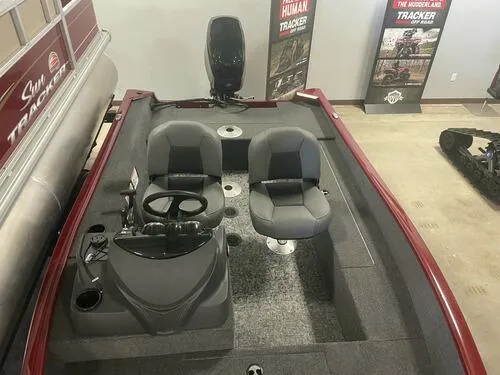 Slide: The Image of 2024 Tracker Super Guide V-16 SC fishing boat interior with dual seats and steering console. - 11