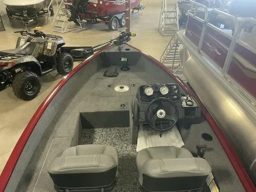 Slide: The Image of 2024 Tracker Super Guide V-16 SC fishing boat interior with steering console and seating. - 12