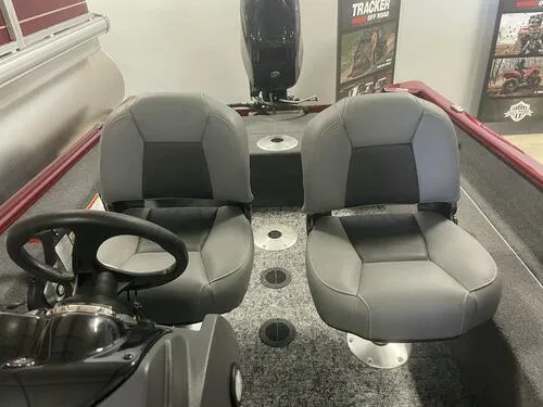 Slide: The Image of 2024 Tracker Super Guide V-16 SC boat interior with dual seats and steering console. - 14