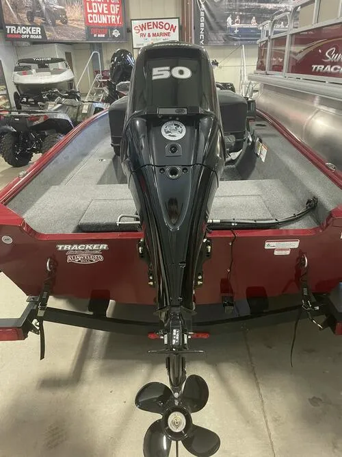 Slide: The Image of 2024 Tracker Super Guide V-16 SC boat with 50 HP motor in showroom. - 6