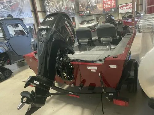 Slide: The Image of 2024 Tracker Super Guide V-16 SC boat with Mercury 50 outboard motor in showroom. - 7