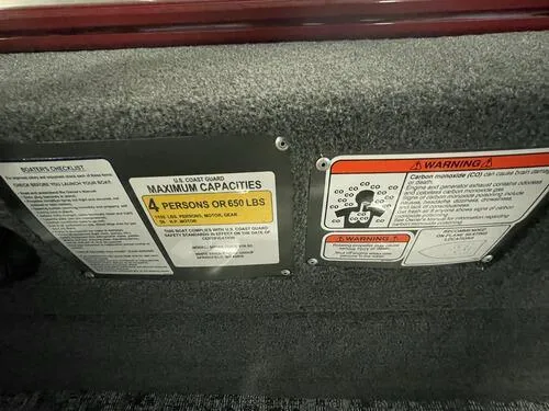 Slide: The Image of 2024 Tracker Super Guide V-16 SC capacity and warning labels. - 8