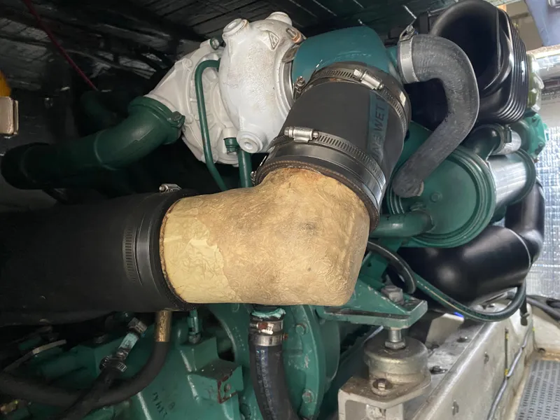 Slide: The Image of Close-up of a 1997 Norstar 302 engine with visible hoses and components. - 38