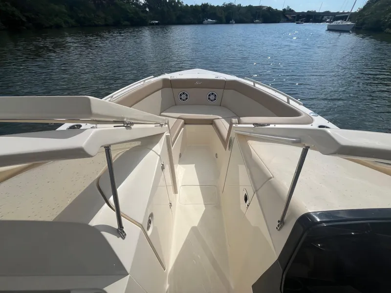 Slide: The Image of 2024 Scout 240 Dorado boat interior on a calm lake. - 23