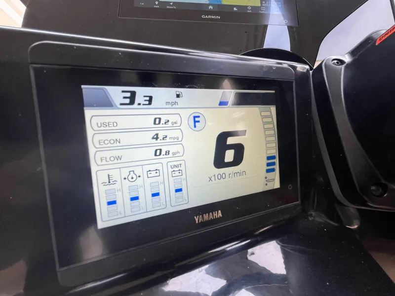 Slide: The Image of 2024 Scout 240 Dorado Yamaha display showing speed, fuel usage, and RPM. - 26
