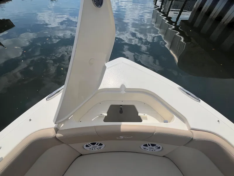 Slide: The Image of 2024 Scout 240 Dorado boat bow with open storage compartment. - 29