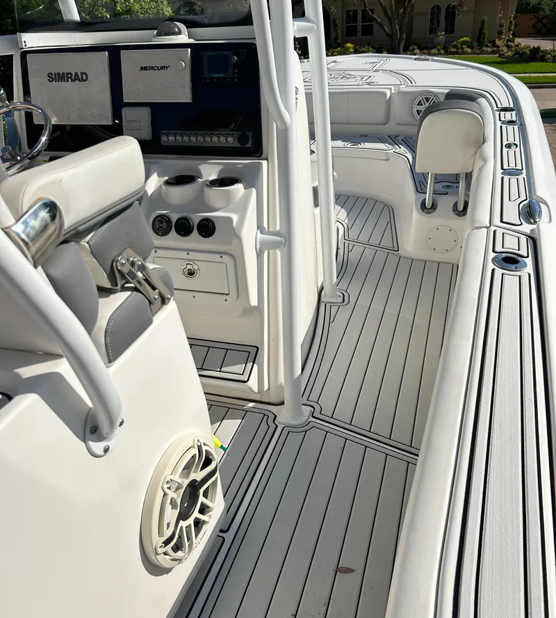Slide: The Image of 2018 Tidewater 2700 Carolina Bay boat interior with modern controls and seating. - 16