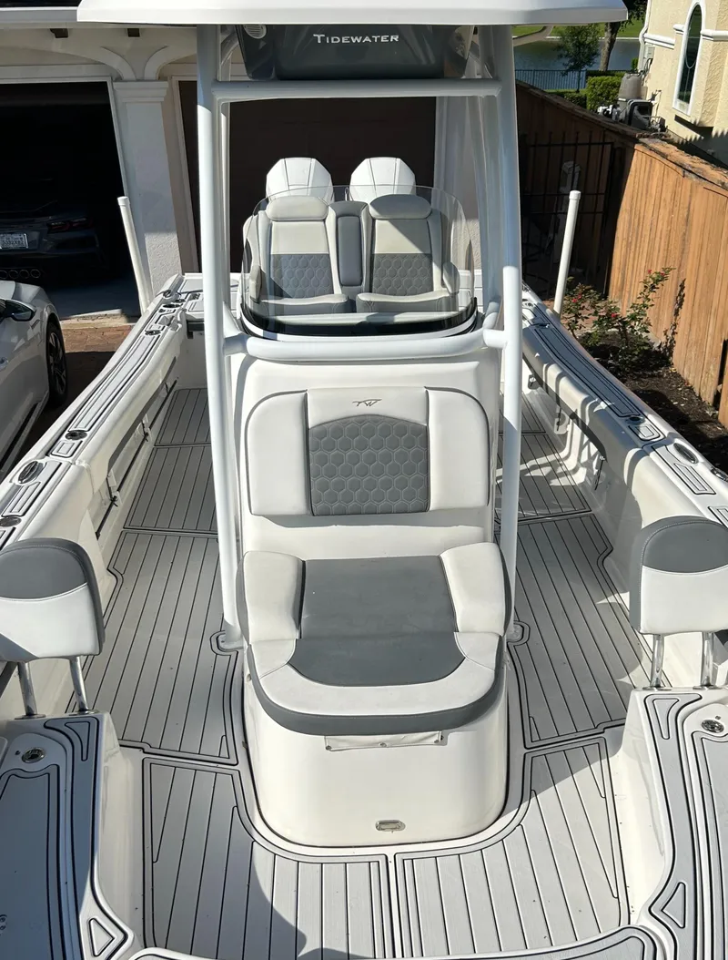 Slide: The Image of 2018 Tidewater 2700 Carolina Bay boat interior with seating and console. - 19