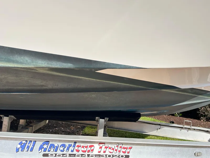 Slide: The Image of 2018 Tidewater 2700 Carolina Bay boat on All American Trailer. - 26