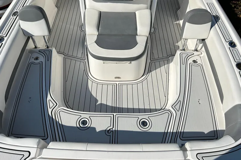 Slide: The Image of 2018 Tidewater 2700 Carolina Bay boat interior with cushioned seating and sleek deck design. - 3