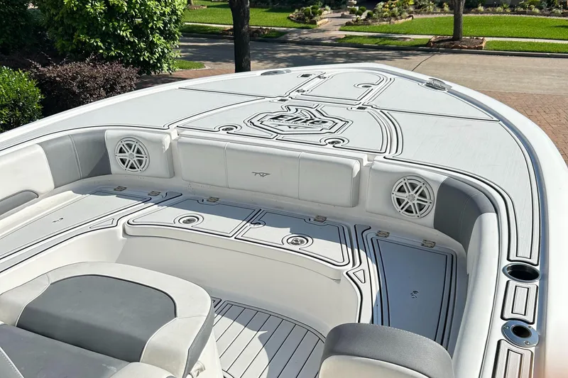 Slide: The Image of 2018 Tidewater 2700 Carolina Bay boat interior with seating and deck details. - 7