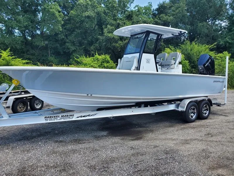 The Image of 2024 Sportsman Masters 267OE Bay boat on trailer in outdoor setting. - 1