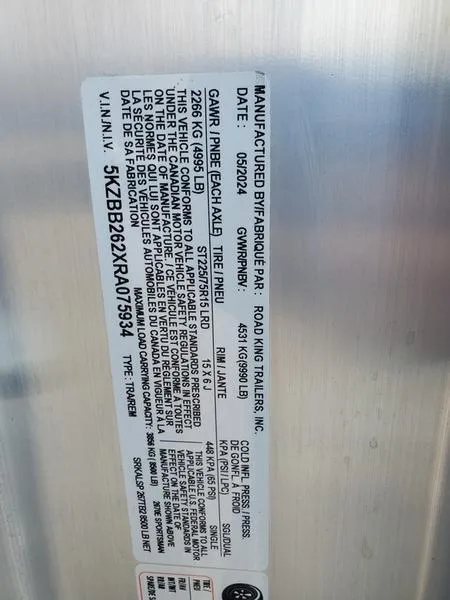 Slide: The Image of 2024 Sportsman Masters 267OE Bay trailer VIN label with specifications and manufacturing details. - 13