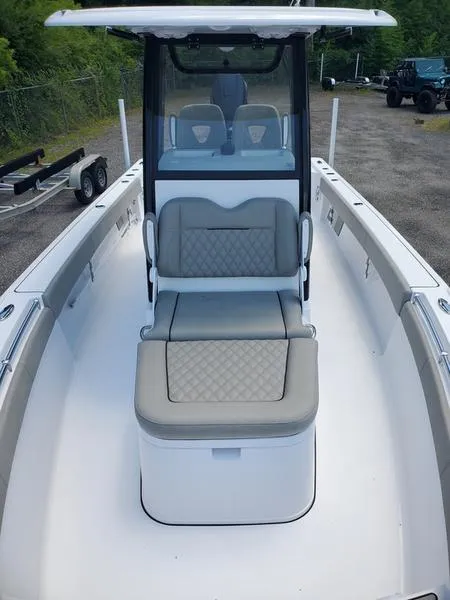 Slide: The Image of 2024 Sportsman Masters 267OE Bay boat interior with seating and console. - 5
