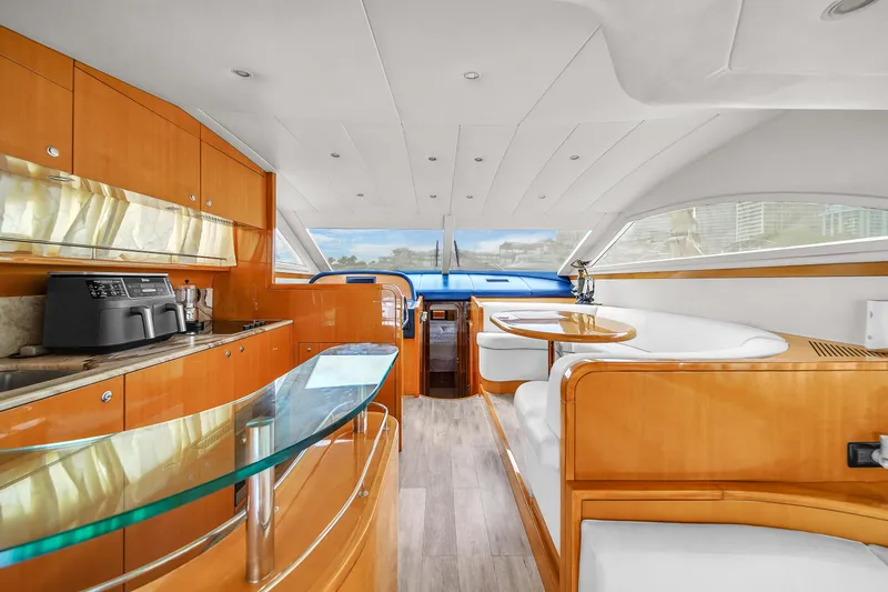 Slide: The Image of Interior of 2006 Uniesse 58 yacht with modern kitchen and dining area. - 16