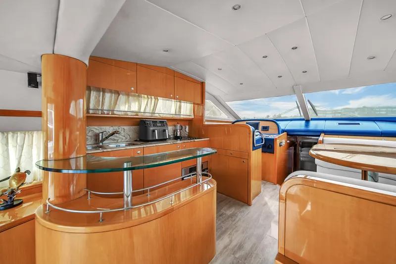Slide: The Image of Luxurious interior of 2006 Uniesse 58 yacht with modern kitchen and helm station. - 20