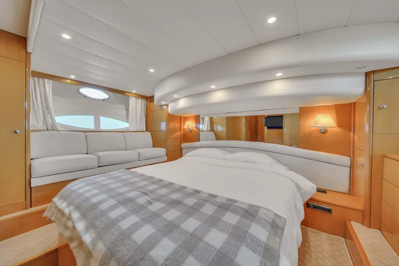 Slide: The Image of Luxurious bedroom interior of a 2006 Uniesse 58 yacht with modern design. - 27