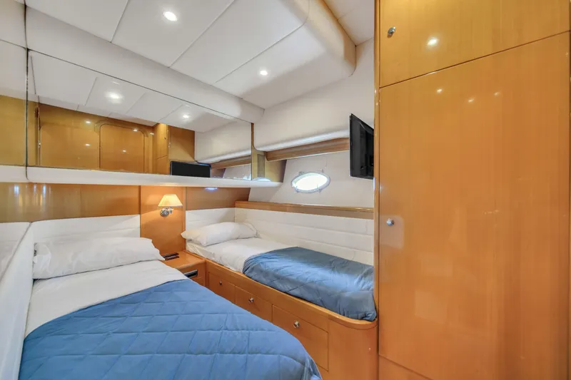 Slide: The Image of Luxurious twin cabin interior of 2006 Uniesse 58 yacht with modern amenities. - 33