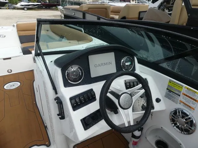 Slide: The Image of 2024 Hurricane SunDeck 2486 OB boat dashboard with Garmin navigation system. - 11