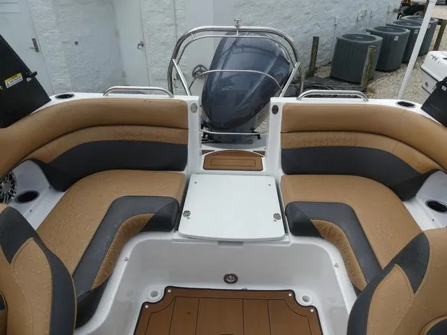 Slide: The Image of 2024 Hurricane SunDeck 2486 OB boat seat with brown and black upholstery. - 14
