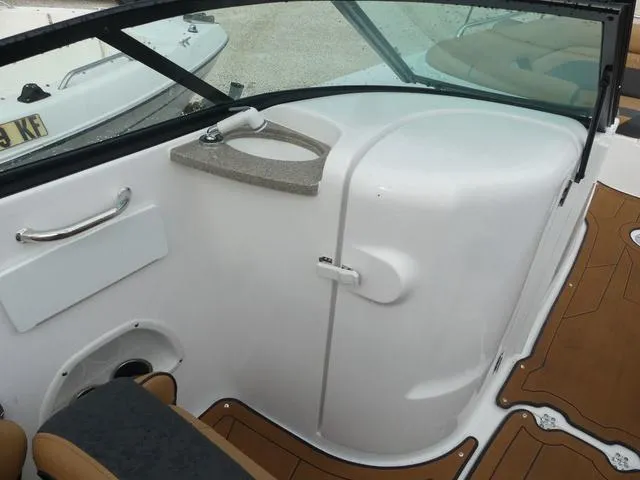 Slide: The Image of 2024 Hurricane SunDeck 2486 OB boat interior with tan and gray seating. - 16