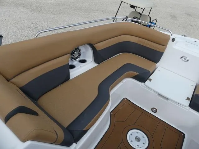 Slide: The Image of 2024 Hurricane SunDeck 2486 OB boat interior with tan and gray seating. - 18