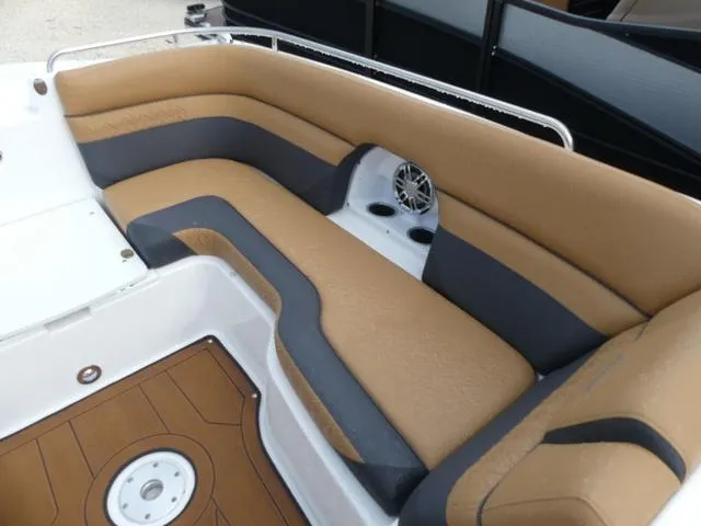 Slide: The Image of 2024 Hurricane SunDeck 2486 OB boat with tan and black seating. - 19