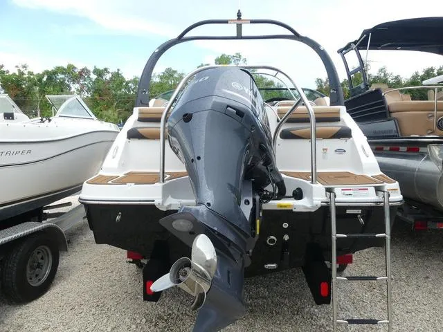 Slide: The Image of 2024 Hurricane SunDeck 2486 OB boat interior with tan and black seating. - 6