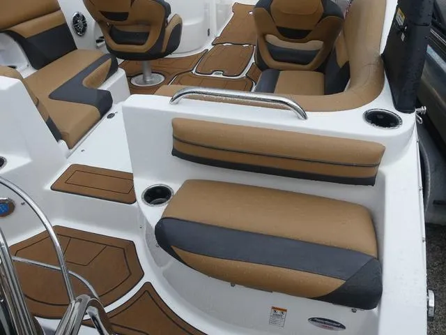 Slide: The Image of 2024 Hurricane SunDeck 2486 OB boat interior with tan and black seating. - 7