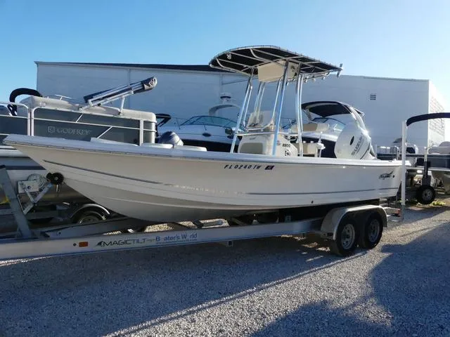 Slide: The Image of 2024 Bulls Bay 2200 boat on trailer in a sunny outdoor setting. - 1