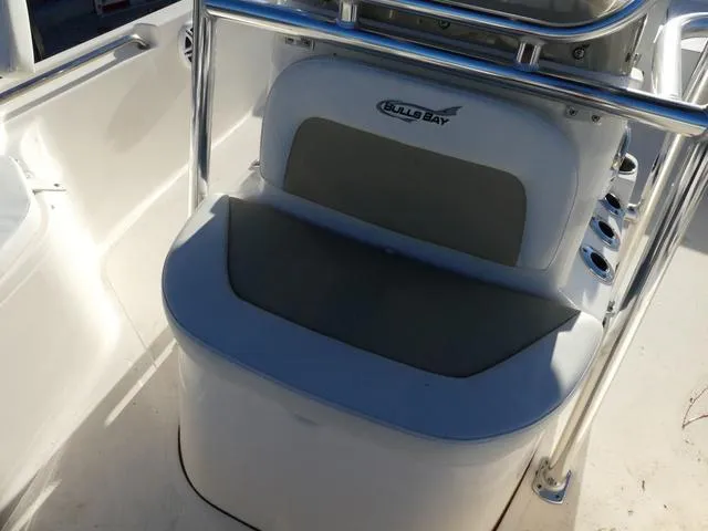 Slide: The Image of 2024 Bulls Bay 2200 boat console with seating and stainless steel frame. - 13