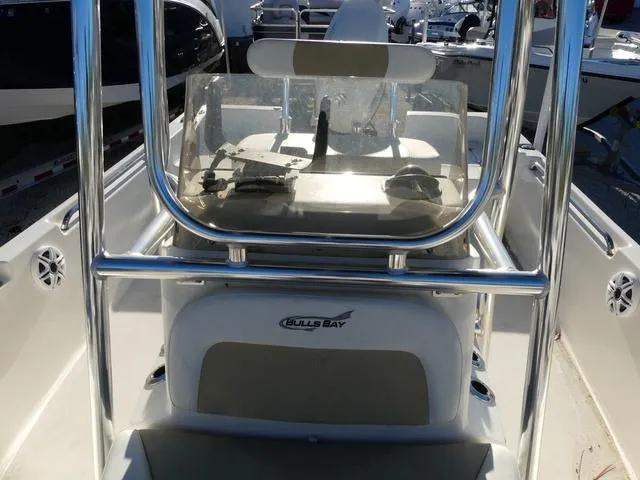 Slide: The Image of 2024 Bulls Bay 2200 boat console with steering wheel and windshield. - 14