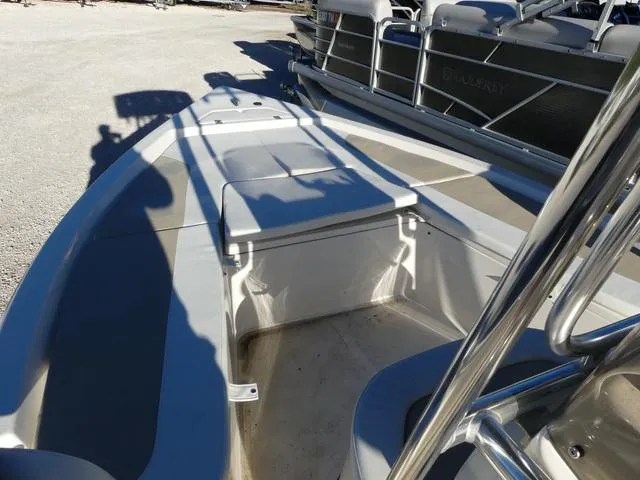 Slide: The Image of 2024 Bulls Bay 2200 boat interior with seating and storage compartments. - 18