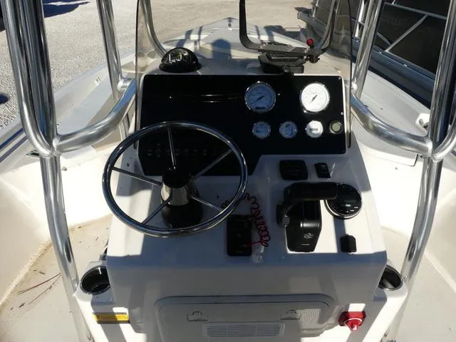 Slide: The Image of 2024 Bulls Bay 2200 boat console with steering wheel and gauges. - 7
