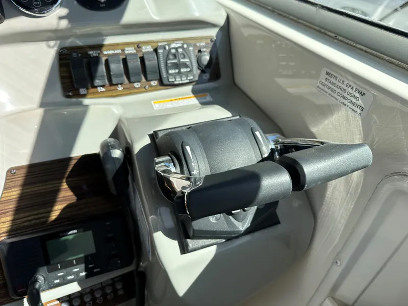 Slide: The Image of Close-up of 2012 Bayliner 335 Cruiser control panel and throttle. - 10