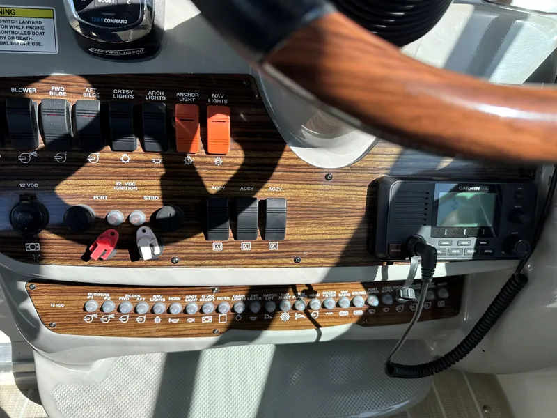 Slide: The Image of Control panel of a 2012 Bayliner 335 Cruiser boat with Garmin navigation system. - 11