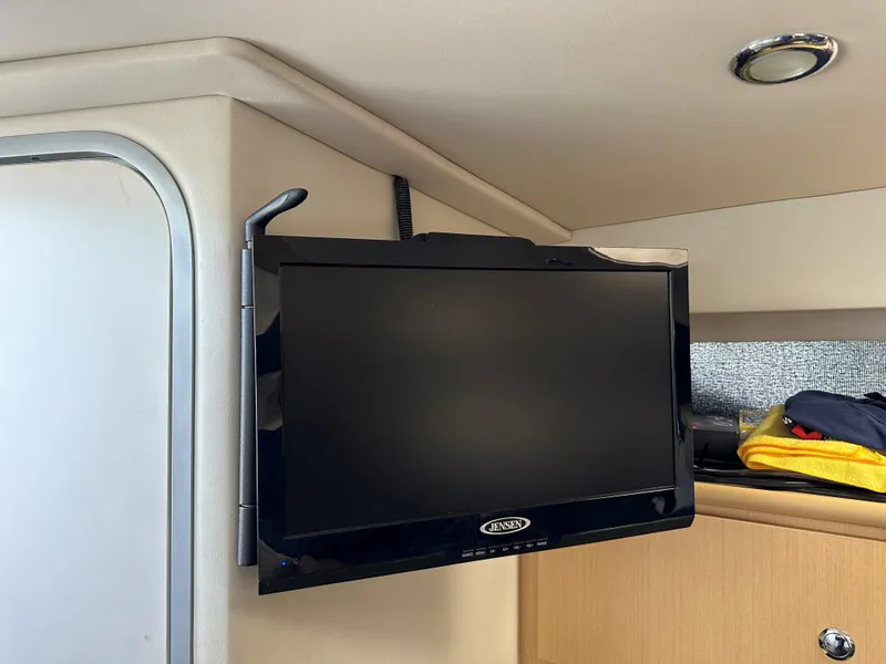 Slide: The Image of Flat-screen TV in the cabin of a 2012 Bayliner 335 Cruiser boat. - 15